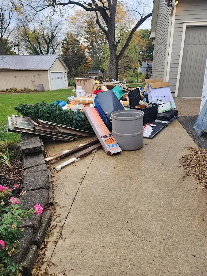 Dumpster being loaded with debris for 10 Yard Dumpster Rental in Eastman